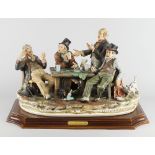 A Capodiamonte limited edition porcelain figure group of a group of four card players, seated at a