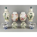 A pair of Mason's baluster vases and covers, decorated in green floral designs, 41cm high,