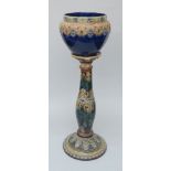 A Doulton pottery jardiniere and stand, late 19th century, the pot moulded with stiff leaves and