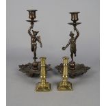A pair of French bronzed metal figural candlesticks, late 19th century,
