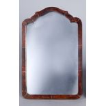 An Edwardian tortoise shell mirror, of shaped outline, with an easel form support, 35 x 23.