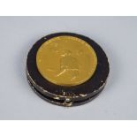 A gilt bronze medal designed by Fritz Huguenin, probably for an Industrial Prize,