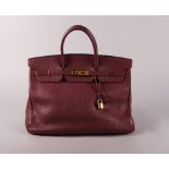 Hermes Birkin handbag, date code for 2000, burgundy Clemence leather with gold plated hardware,