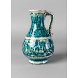 A Delft Iznik style vase, 19th century, of baluster form, with curved handle,