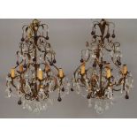 A pair of six light painted metal and lustre hung chandeliers, of modern manufacture,