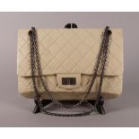 A Chanel quilted cream leather shoulder bag,