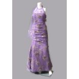Jacques Azagury: a lilac shot silk and lilac net evening gown, with silk applique flowers,