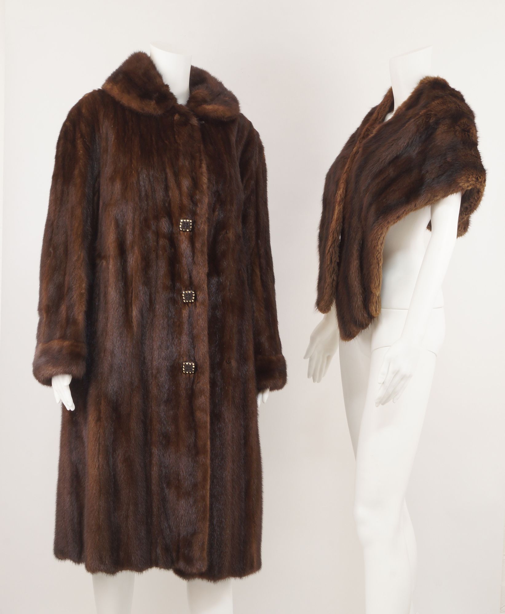 A full length mink coat, with leather covered buttons, by Cavendish House, Cheltenham,