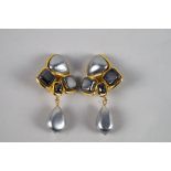 Chanel: a pair of silver-grey faux pearl ear-clips, 1991, of arrow head form,