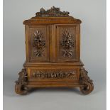 A German or Austrian carved wood cigar cabinet, late 19th/early 20th century,