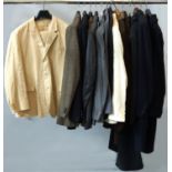 A collection of men's suits, jackets and trousers,