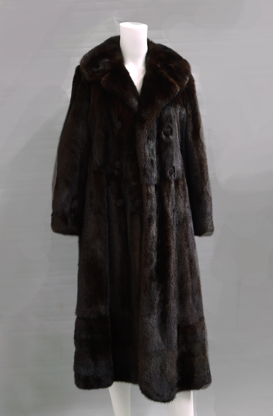 A dark brown full length ranch mink coat by Calman Links, double breasted with silk covered buttons,