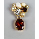 Chanel: a gilt metal, crystal, faux pearl and paste topaz brooch, 1990, of triangular form,