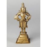 WITHDRAWN A brass statue of Vishnu, India, 18th century, on a square base rising in tiers, 15cm.