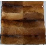 A rectangular fur rug, by Sitz Design,