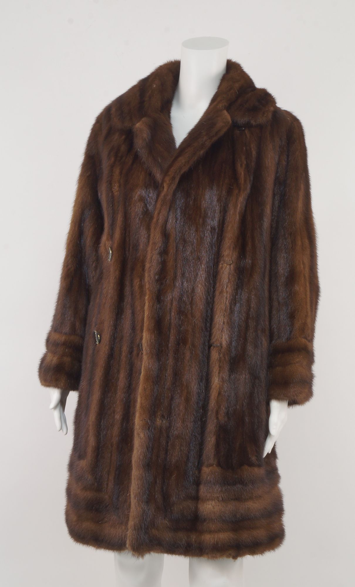 A double breasted mink coat, with rounded collar and lapels, size not stated.