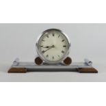 An Art Deco chrome mantel clock, 20th century, with brown Bakerlite feet, 25.