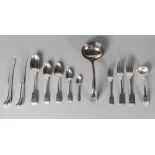 A large quantity of silver flatware, various dates and makers, to include twenty-seven table forks,