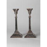 A pair of George VI silver candlesticks, Birmingham c.1937, Britton, Gould & Co.