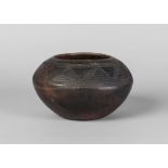 A Bulu pottery globular pottery bowl, incised with geometrical decoration,