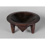 A Fijian hardwood yaqona bowl, 20th century, on four legs with a hanging hook,