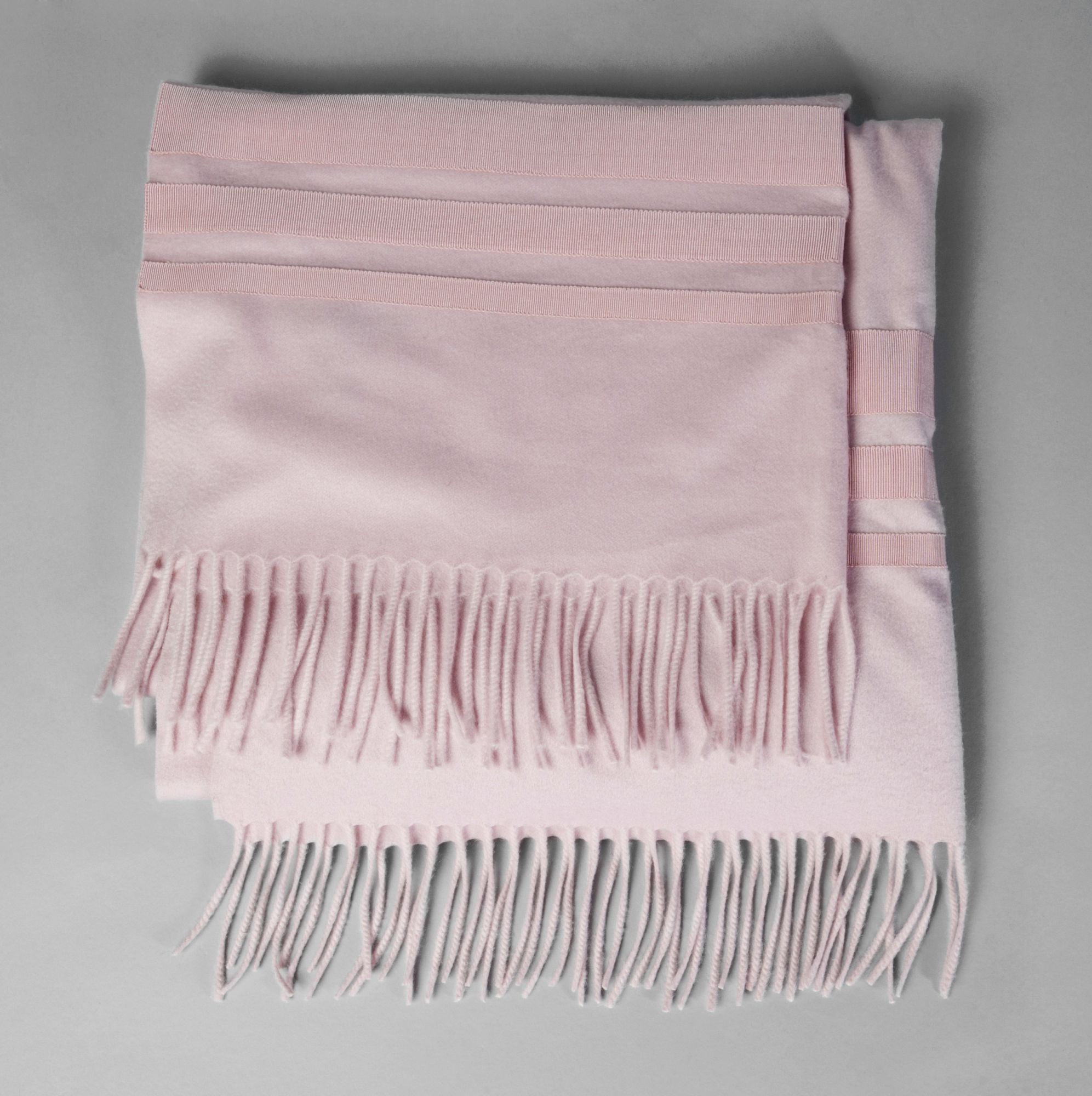A Salvatore Ferragamo dusky pink cashmere shawl, with satin braid bands to both ends, 245cm x 68cm,