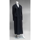 A Salvatore Ferragamo black wool full length coat, front flap pockets and three button cuff,