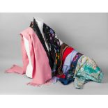 A Gucci shawl, floral design on black ground, together with a pink cashmere scarf by Gucci,