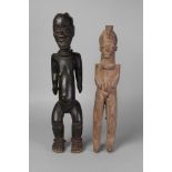 A tribal hardwood figure of a woman, Ivory Coast, Baule,