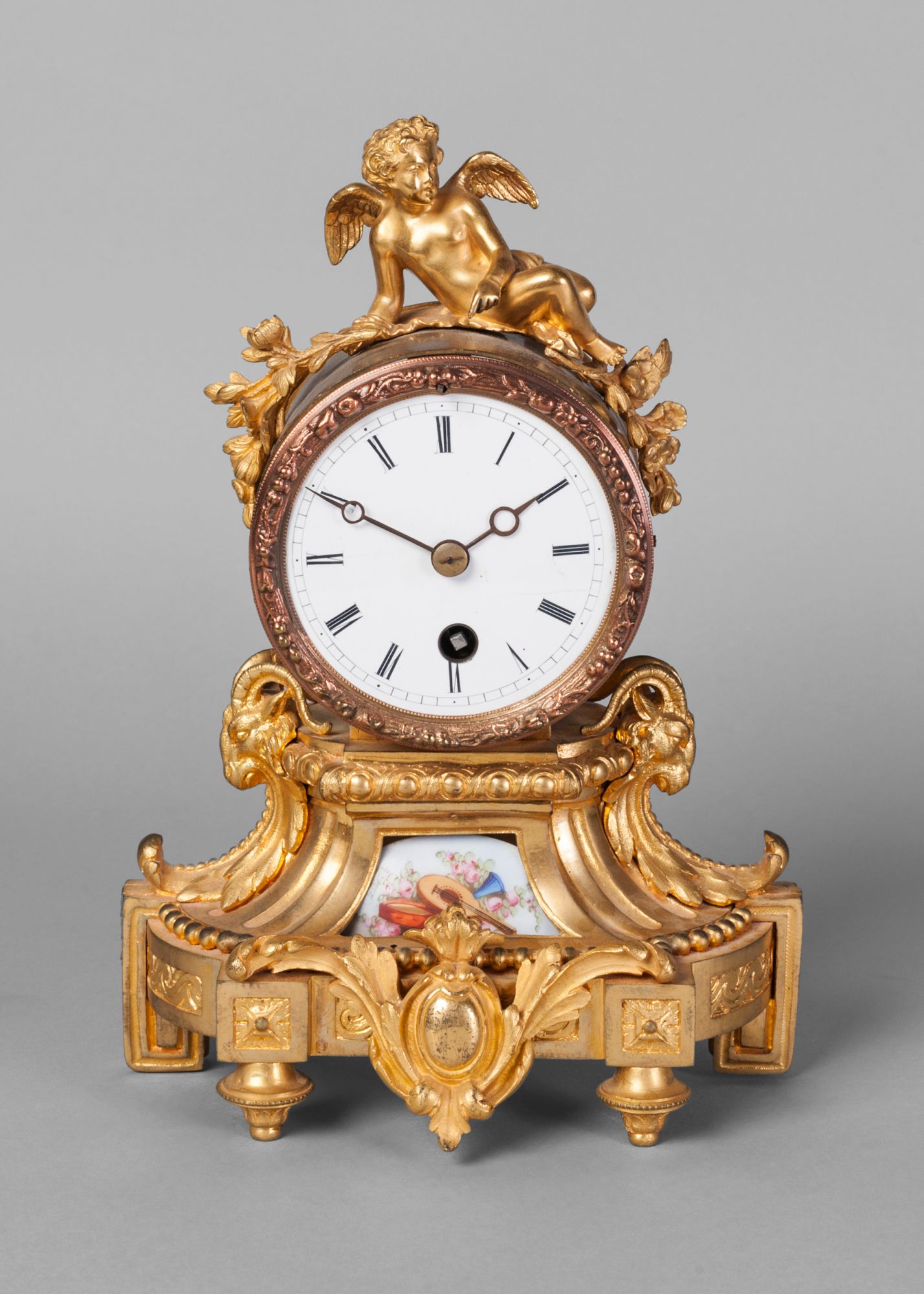 A French gilt bronze and porcelain mounted mantel clock, 19th century,