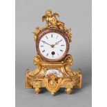 A French gilt bronze and porcelain mounted mantel clock, 19th century,
