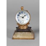 A French desk clock, late 19th century, in the form of a globe resting on a crown with a cushion,