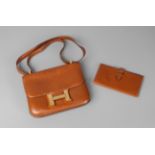 A Hermes tan leather Constance handbag, with gold plated hardware, together with matching wallet,