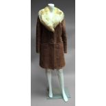 A ladies pink/taupe sheepskin jacket, with fur collar,
