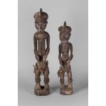 A pair of tribal hardwood figures of a man and woman, Ivory Coast,