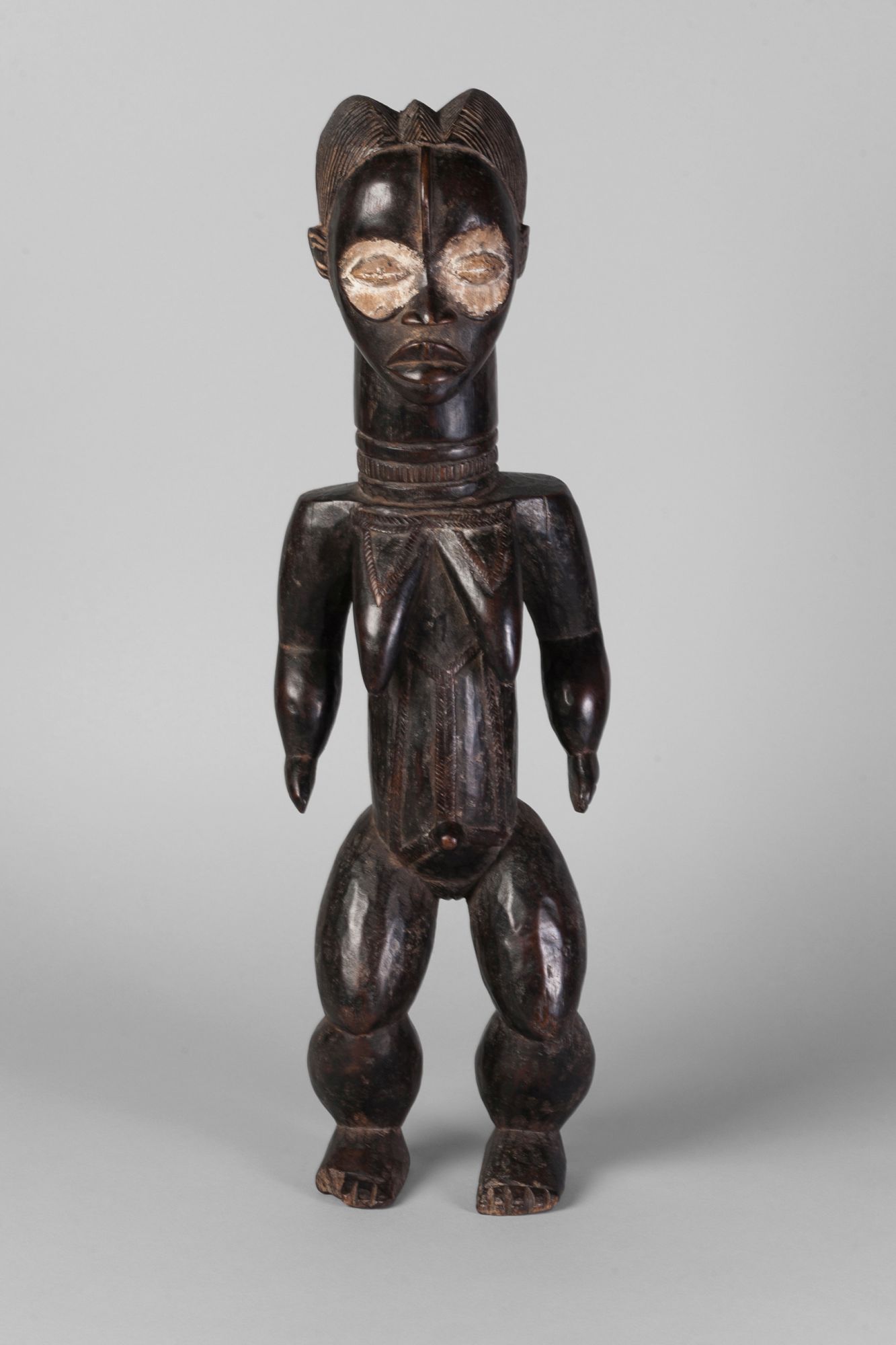 A tribal hardwood ngole figure of a woman, Baule, Ivory Coast,