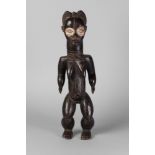 A tribal hardwood ngole figure of a woman, Baule, Ivory Coast,