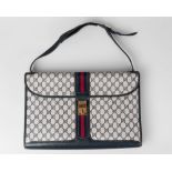 A large Gucci monogram handbag,