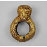 An African tribal gold ring, Ivory Coast, early/mid 20th century, moulded with a male bearded head,