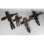 A collection of Tribal hardwood door locks, late 19th/20th century, with various finials,