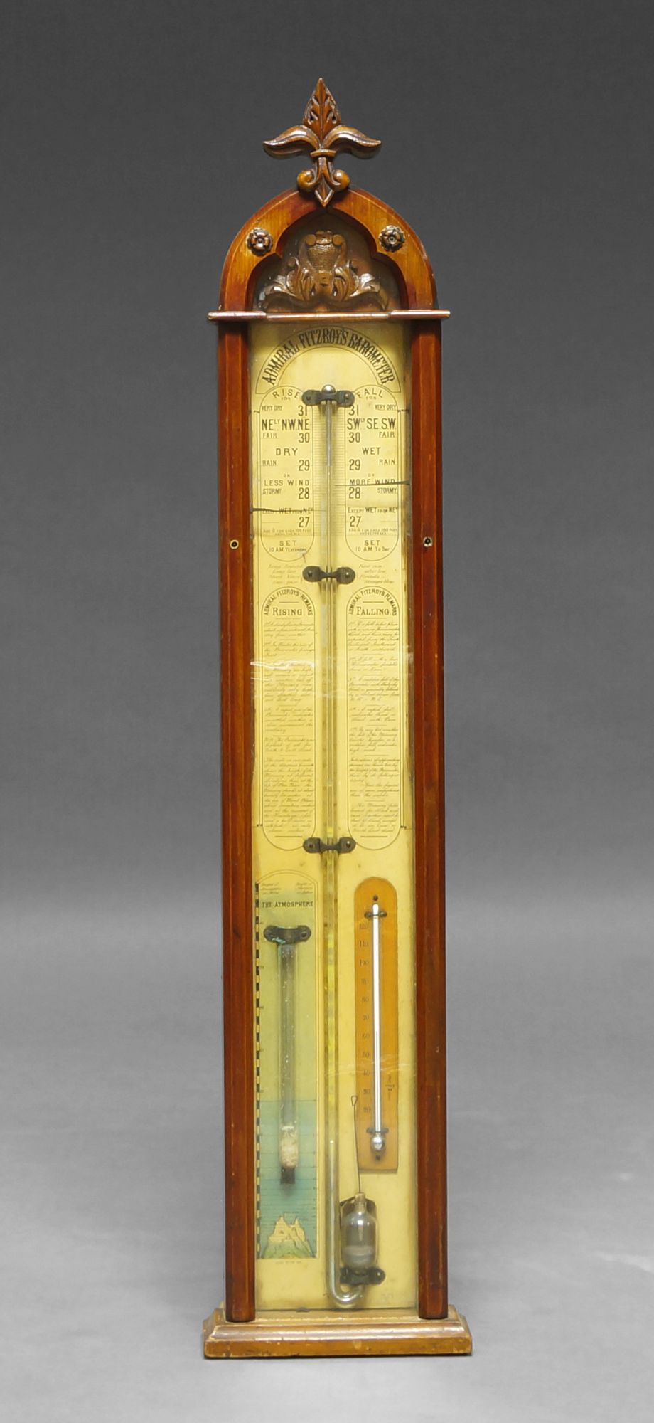 An Admiral Fitzroy barometer, with a mahogany case, with foliate finial,