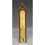 An Admiral Fitzroy barometer, with a mahogany case, with foliate finial,