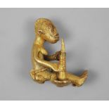 An African tribal gold figure of a seated man with a mortar, Ivory Coast, early/mid 20th century,