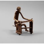 An African tribal gold figure of a seated man, Ivory Coast, early/mid 20th century,