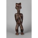 A tribal hardwood ngole figure of a woman, Baule, Ivory Coast,