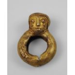 An African tribal gold ring, Ivory Coast, early/mid 20th century, moulded with a head finial,