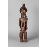 A tribal hardwood ngole figure of a woman, Baule, Ivory Coast,