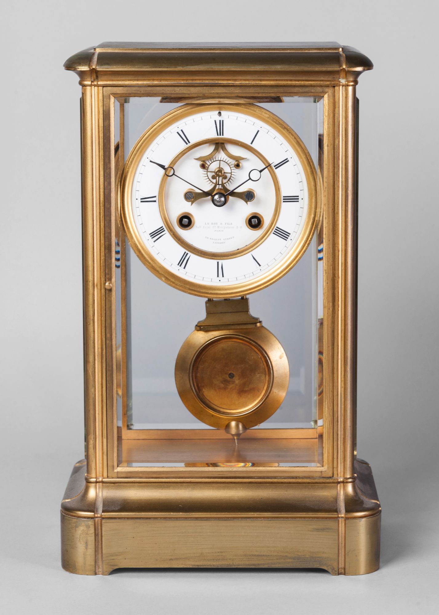 A French brass and glass mantel clock by Le Roy et Fils, 19th century,