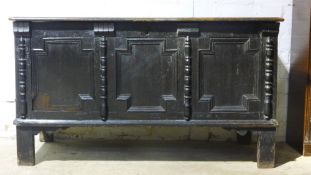 A 17th/18th century oak panelled coffer