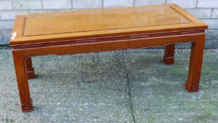 A Chinese hardwood coffee table